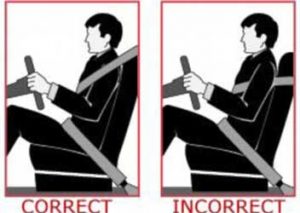 improper seat belt use under arm